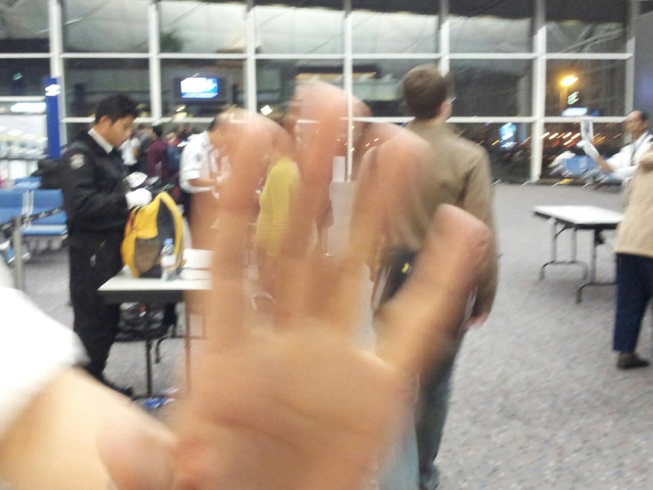 US reaches out to us in Hong Kong airport, and molests us for a second time, at the gate. No photos allowed, citizen!